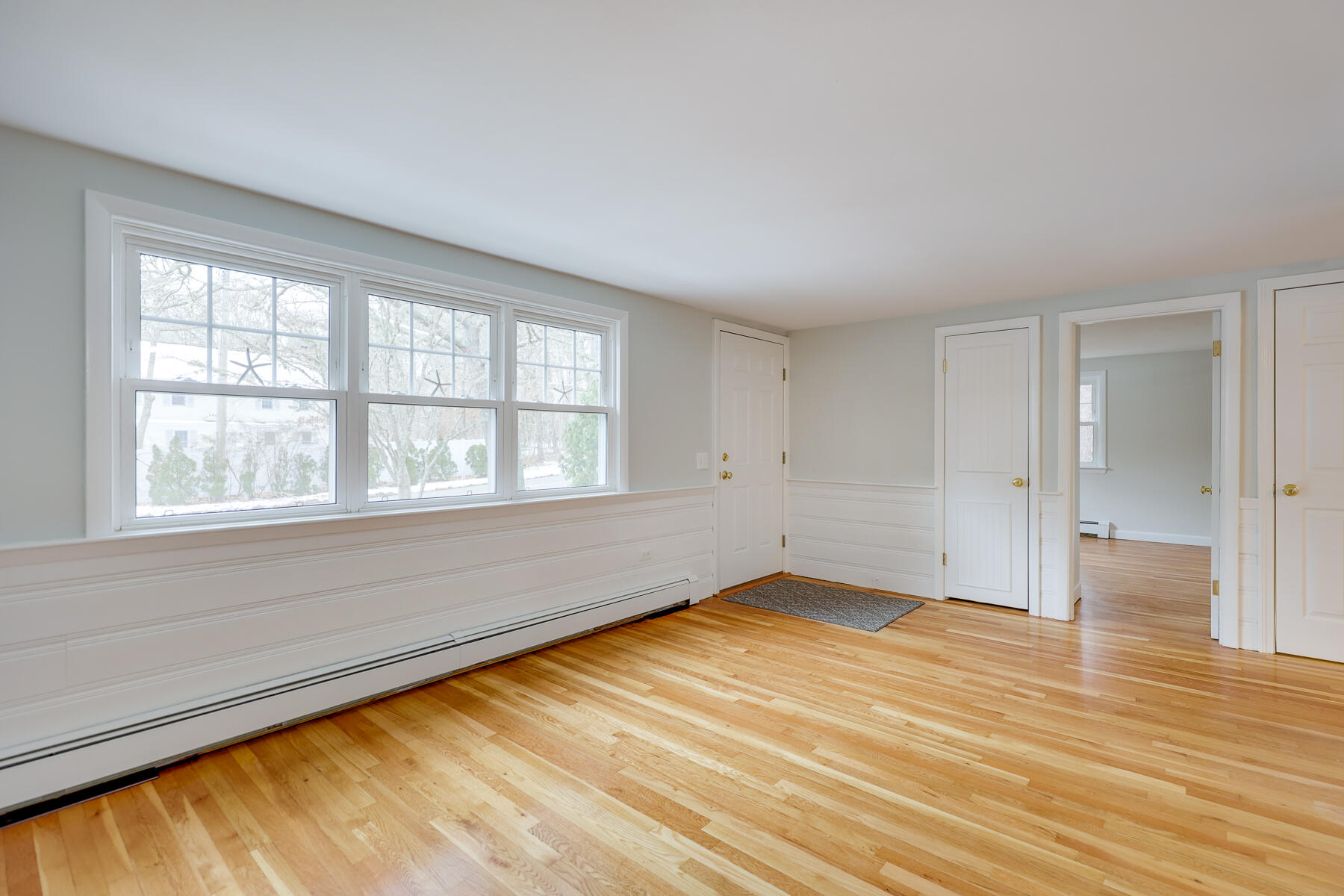 98 Long Road Harwich, MA 02645 - Photo 10 of 31 wooden floor in an empty room with a window