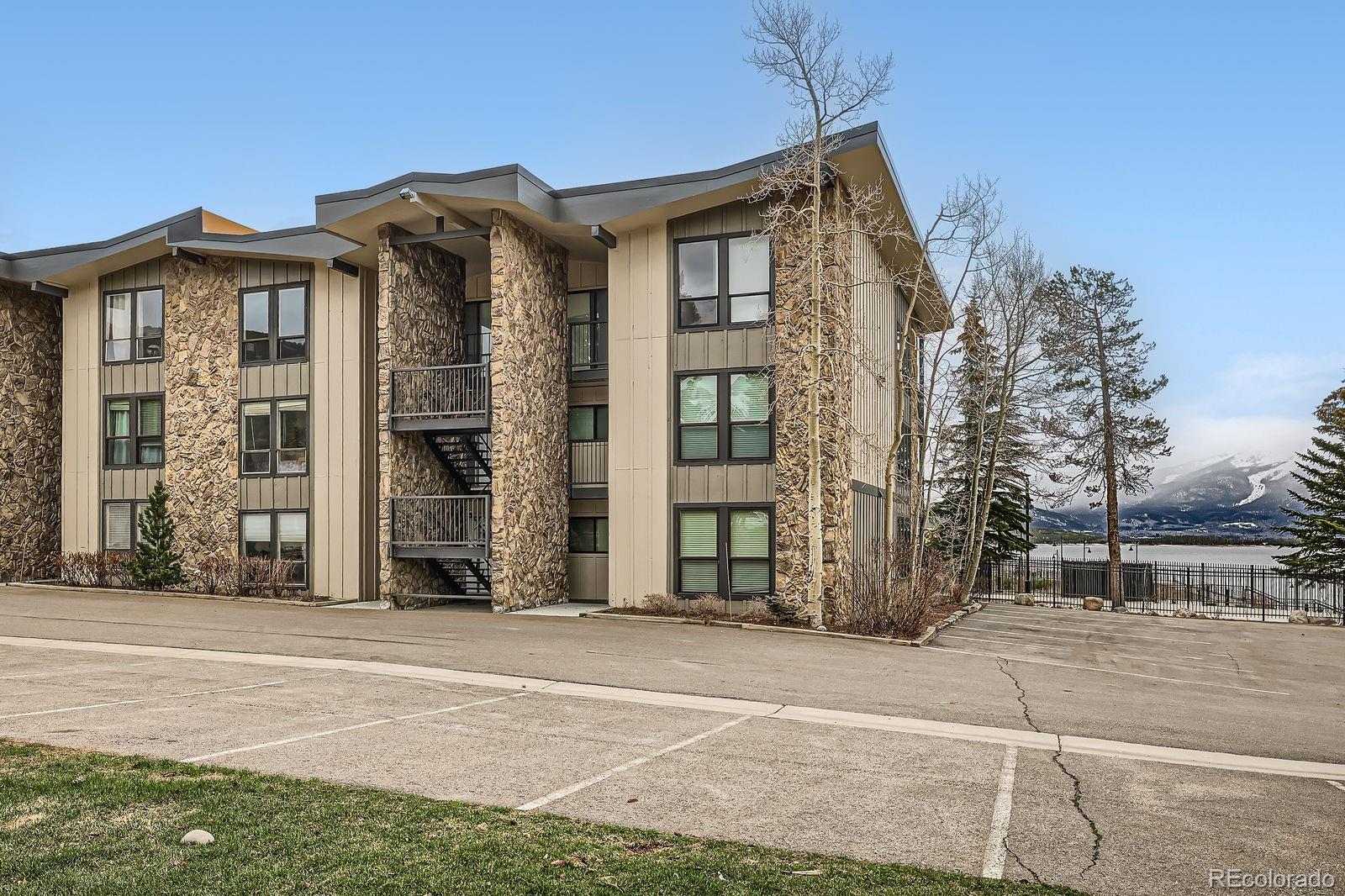 a view of a brick house with many windows