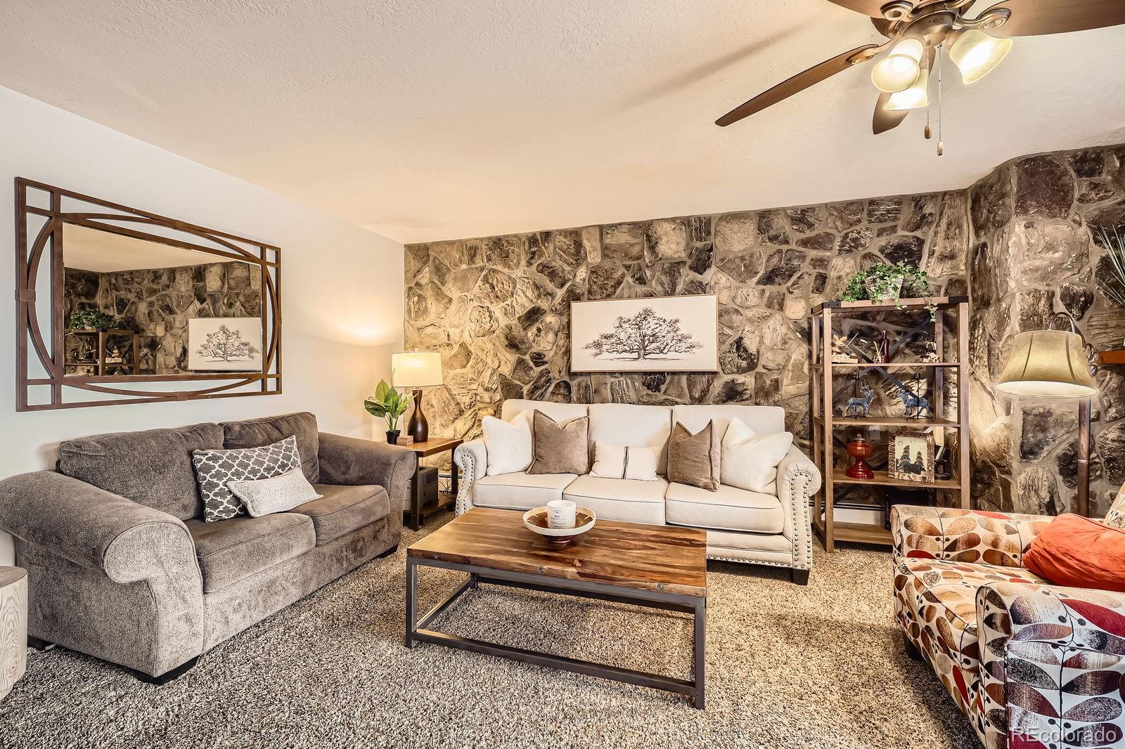 120 E Lane, Unit 109 Dillon, CO 80435 - Photo 11 of 39 a living room with furniture and a large window