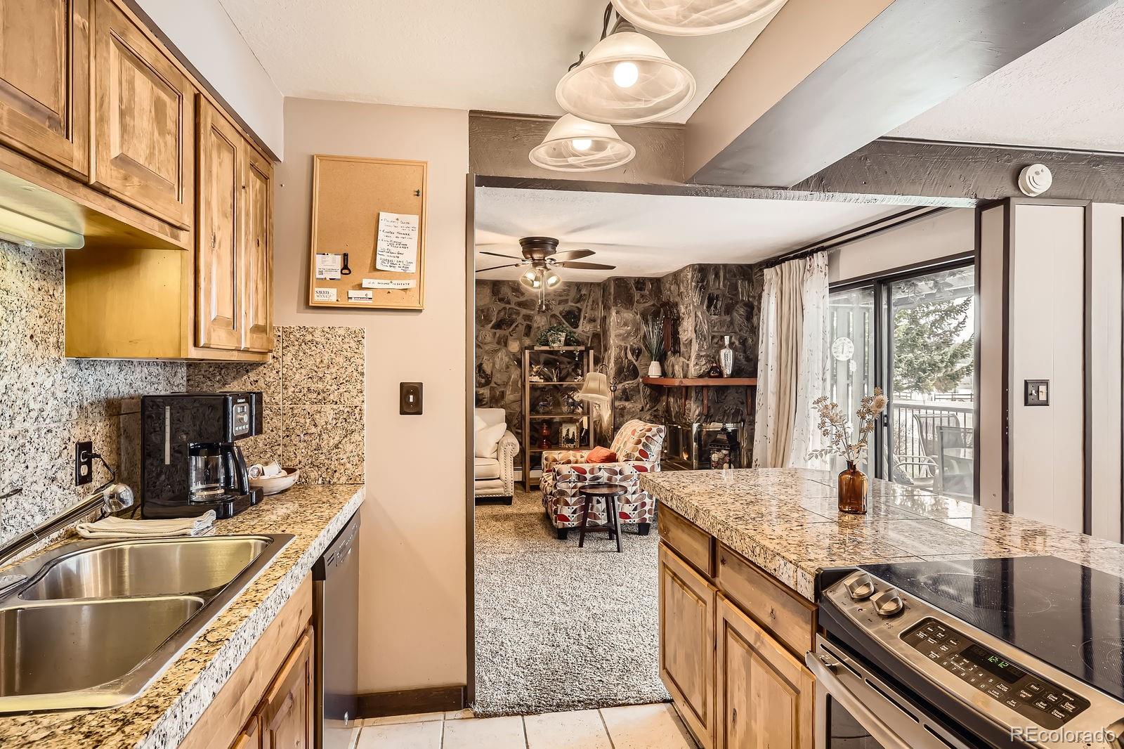 120 E Lane, Unit 109 Dillon, CO 80435 - Photo 14 of 39 a kitchen with a stove and a sink