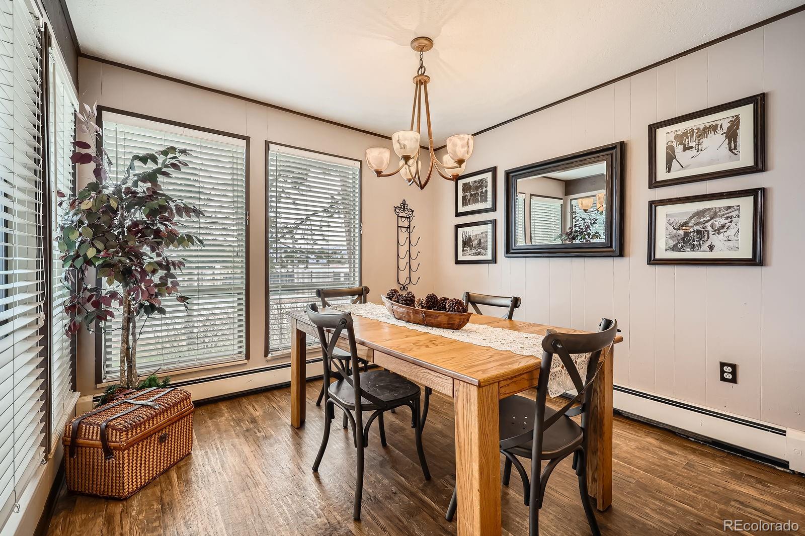 120 E Lane, Unit 109 Dillon, CO 80435 - Photo 16 of 39 a view of a dining room with furniture window and wooden floor