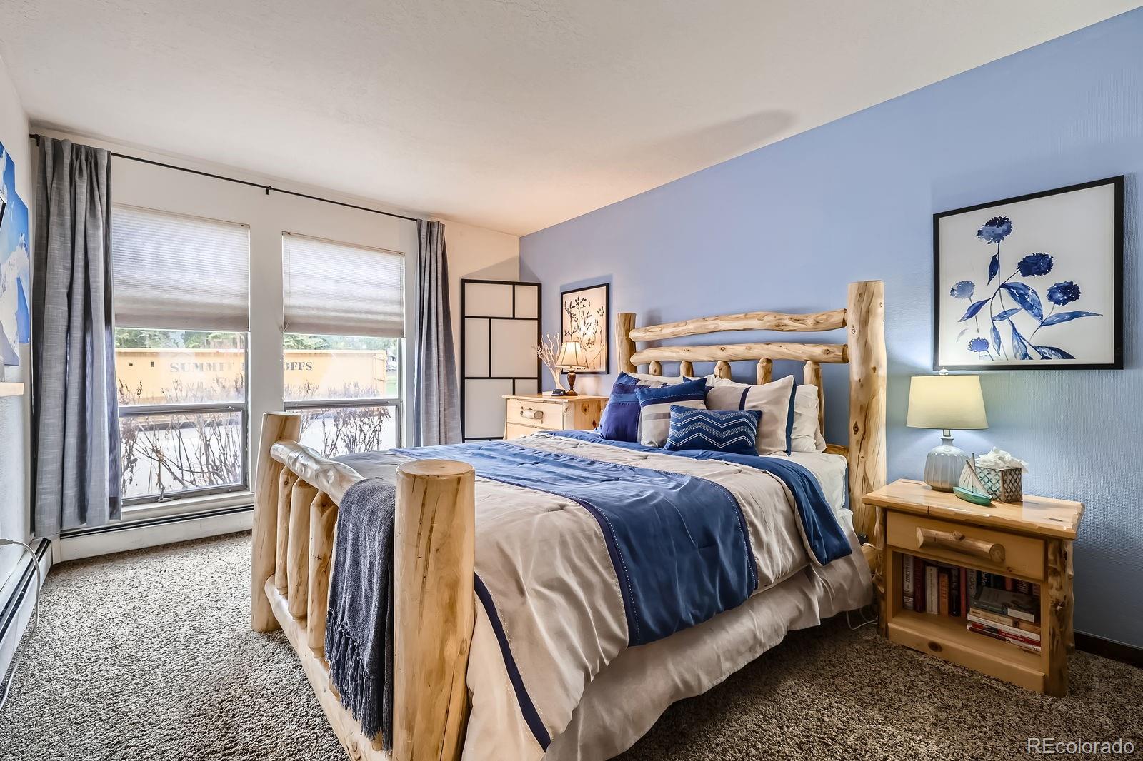 120 E Lane, Unit 109 Dillon, CO 80435 - Photo 19 of 39 a bed room with a bed and a large window