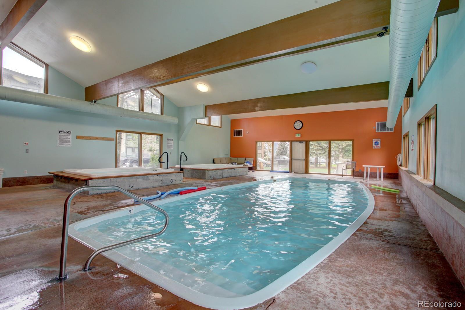 120 E Lane, Unit 109 Dillon, CO 80435 - Photo 35 of 39 a view of swimming pool with a table and chairs