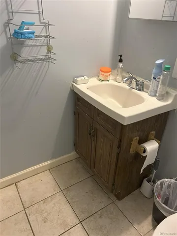 a bathroom with a sink and vanity