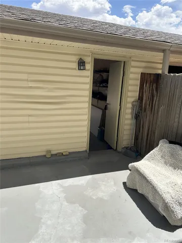 a bedroom with a bed and a white cabinet