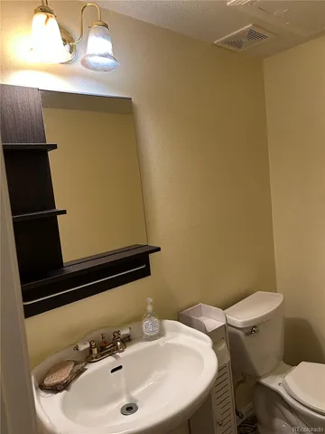a bathroom with a sink and a toilet