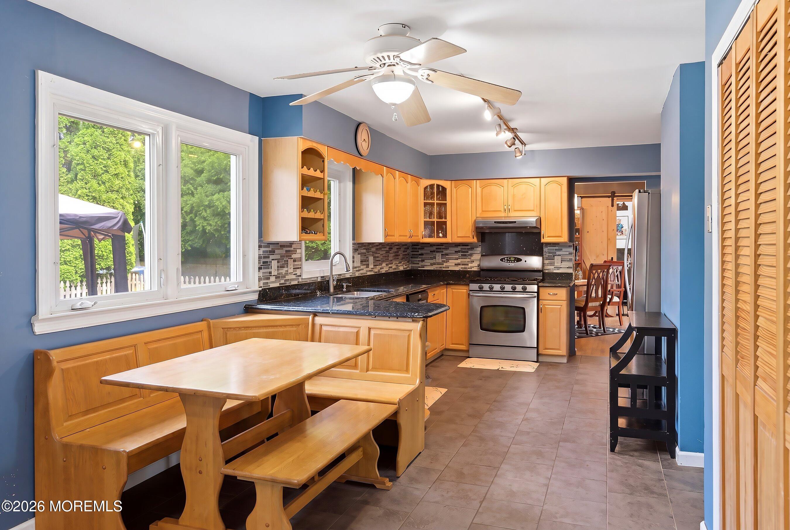 822 York Road Brick, NJ 08724 - Photo 11 of 37 a kitchen with a stove a sink and a refrigerator