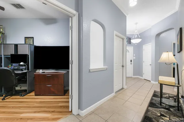 a view of a livingroom with furniture and a flat screen tv