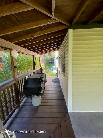 a living room with fireplace furniture and a floor to ceiling window