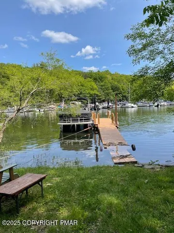 a view of a lake with houses in the back
