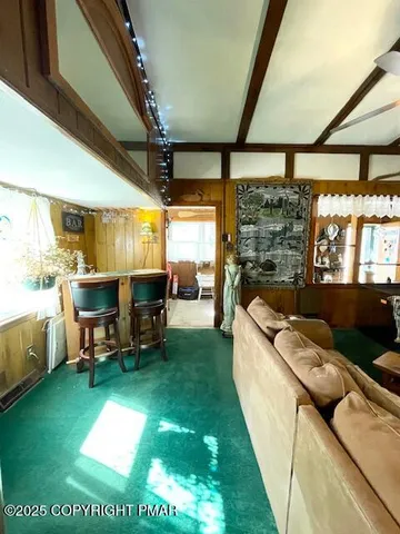 a spacious bedroom with a bed and a window