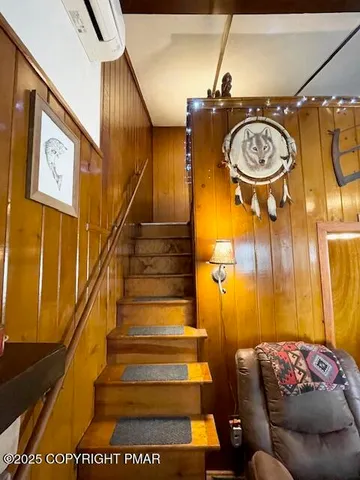 a bathroom with a toilet a sink and a mirror