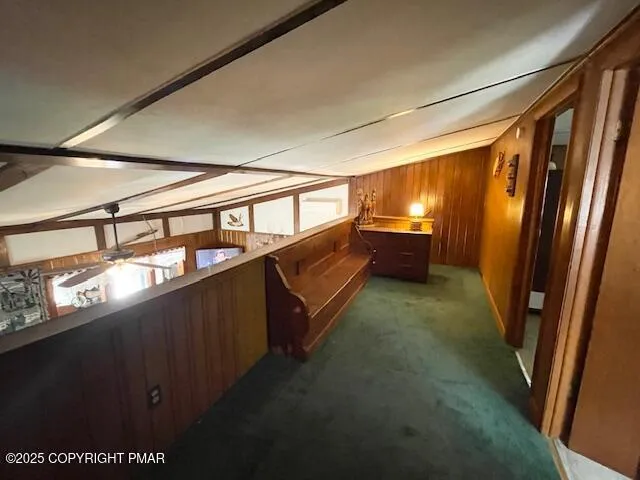 a living room with furniture a rug and a window