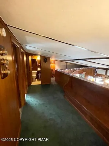 a view of a living room and bathroom