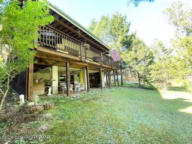 a front view of a house with outdoor seating