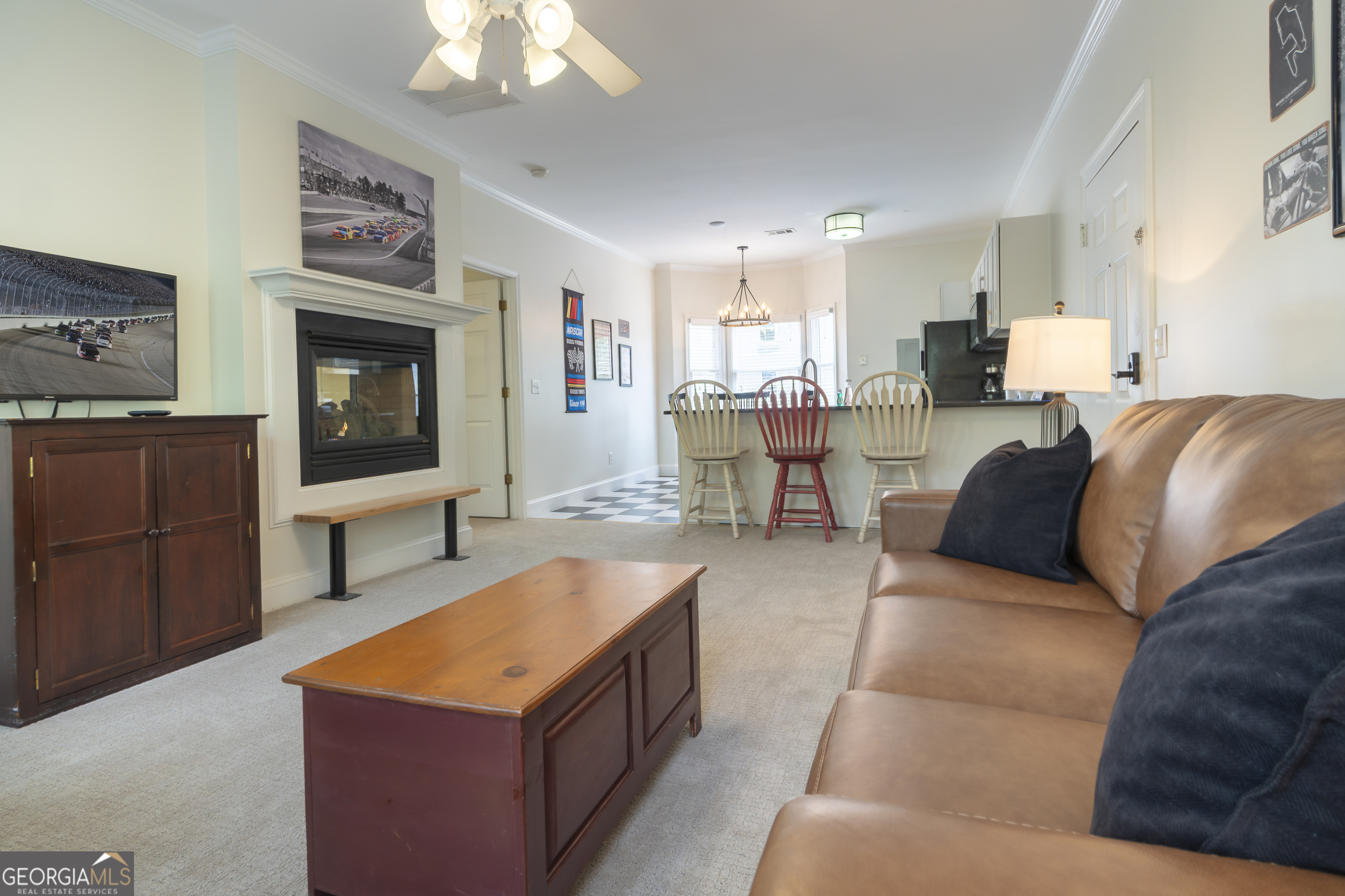 892 Edelweiss Strasse Helen, GA 30545 - Photo 11 of 36 a living room with furniture a fireplace and a flat screen tv