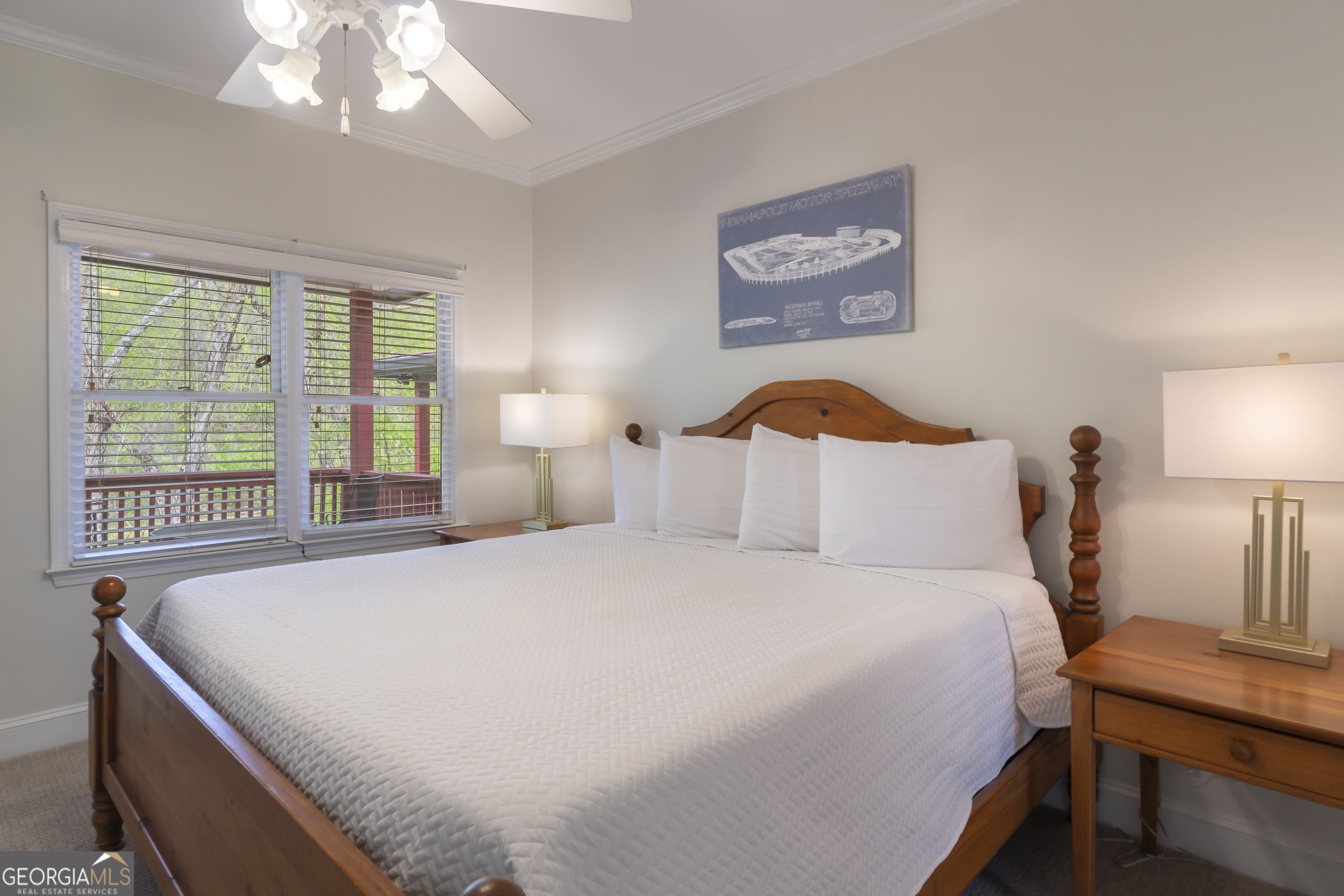 892 Edelweiss Strasse Helen, GA 30545 - Photo 18 of 36 a bedroom with a bed and a chandelier