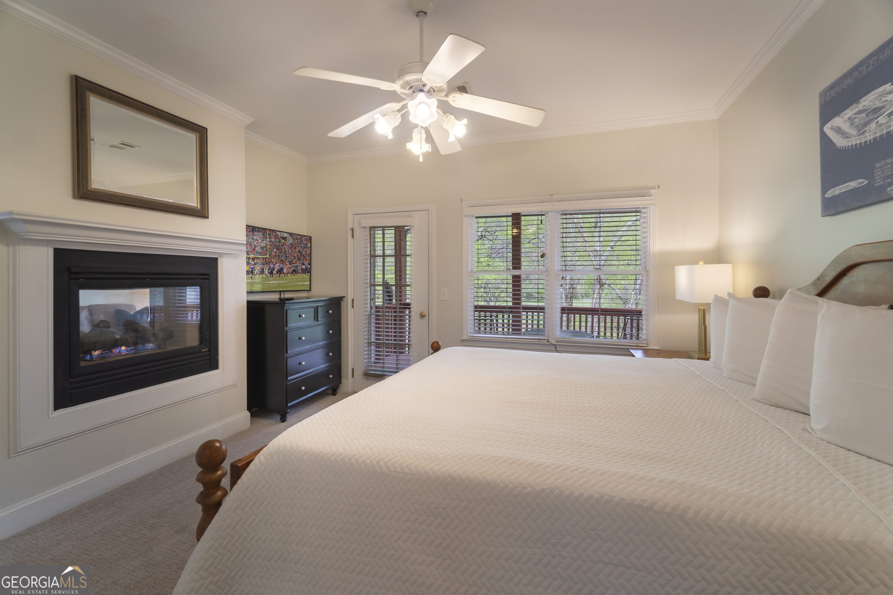 892 Edelweiss Strasse Helen, GA 30545 - Photo 19 of 36 a spacious bedroom with a bed and a fireplace