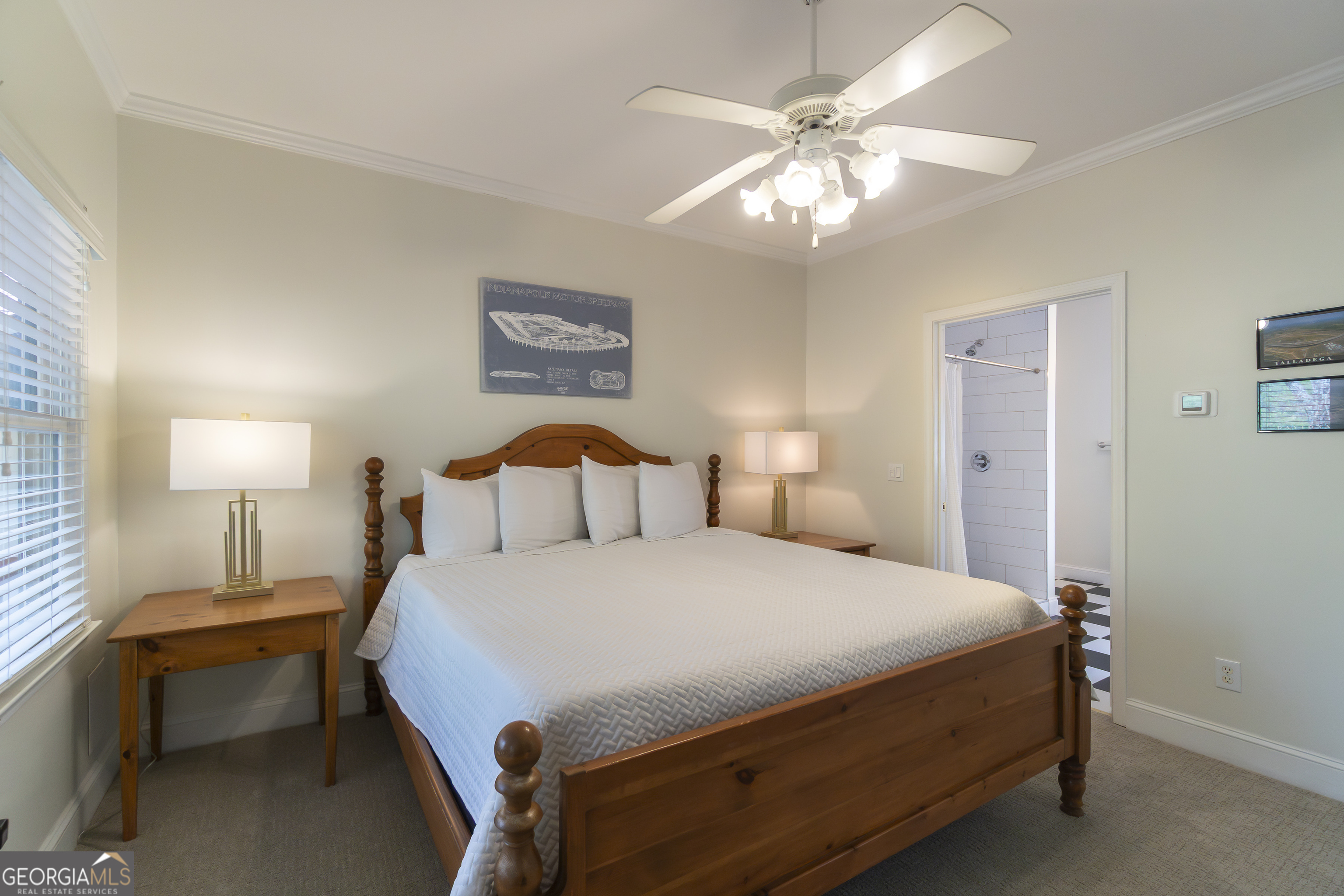 892 Edelweiss Strasse Helen, GA 30545 - Photo 20 of 36 a bedroom with a bed and a chandelier