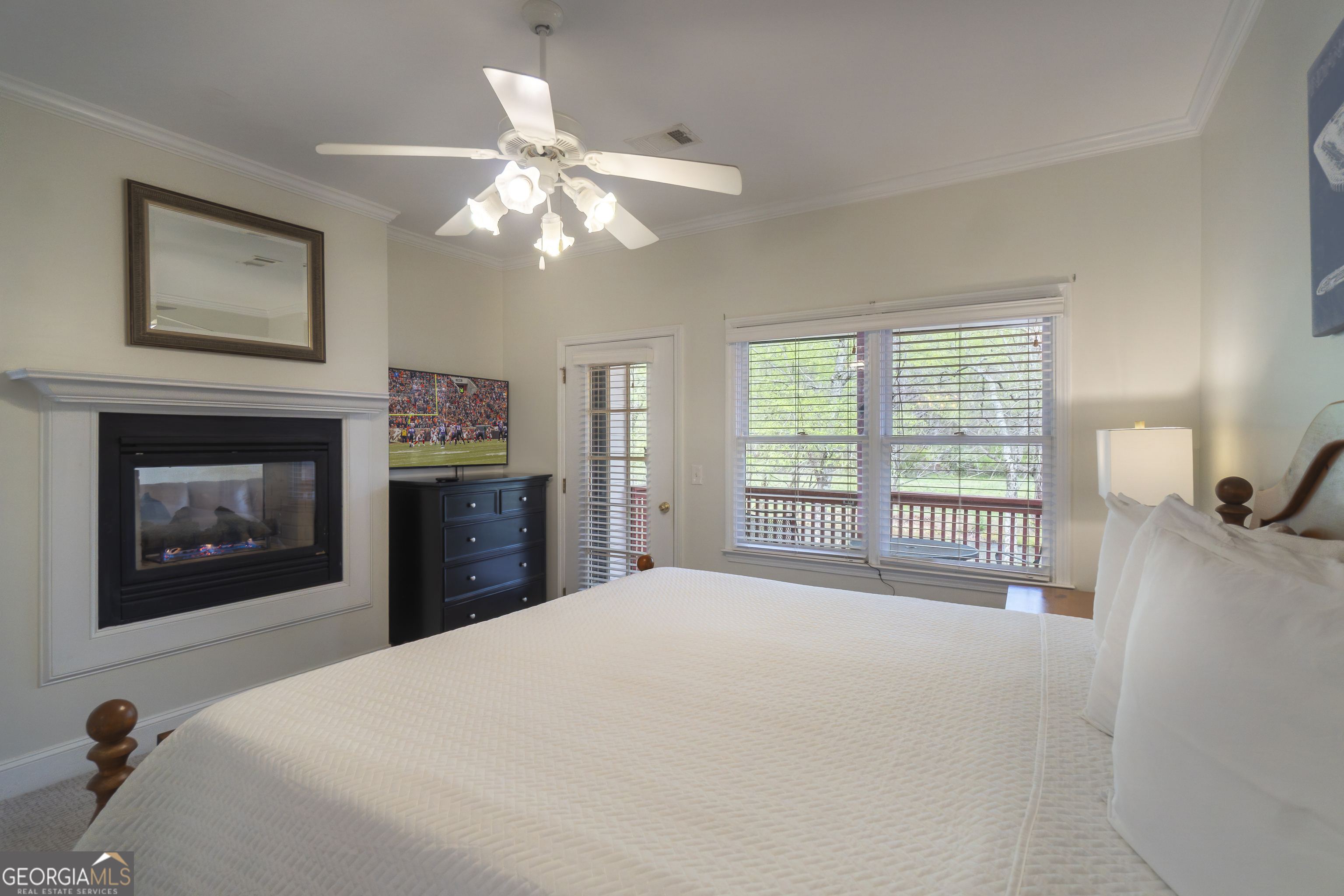 892 Edelweiss Strasse Helen, GA 30545 - Photo 21 of 36 a bedroom with a bed and a fireplace
