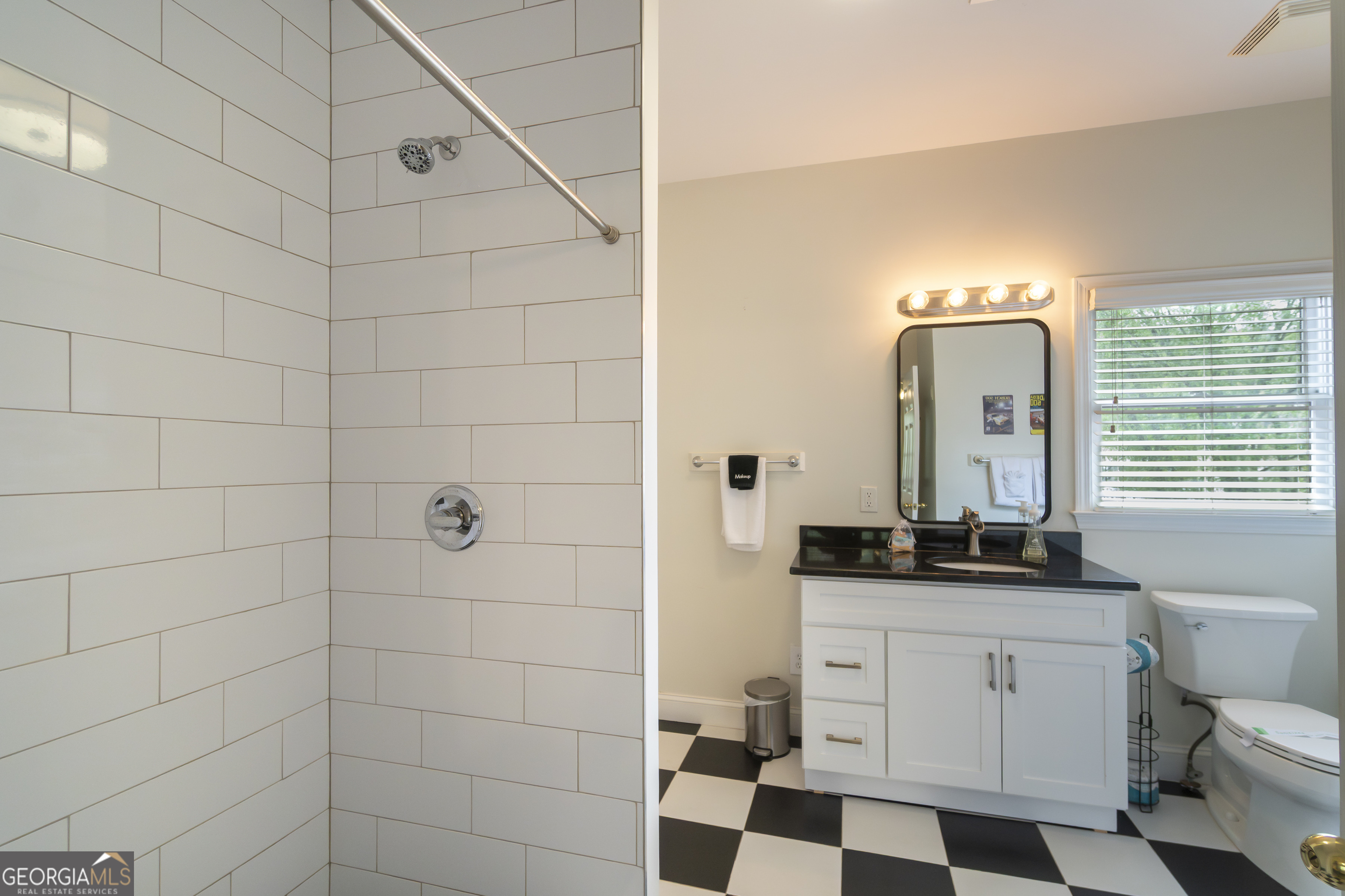 892 Edelweiss Strasse Helen, GA 30545 - Photo 24 of 36 a bathroom with a sink a toilet and shower