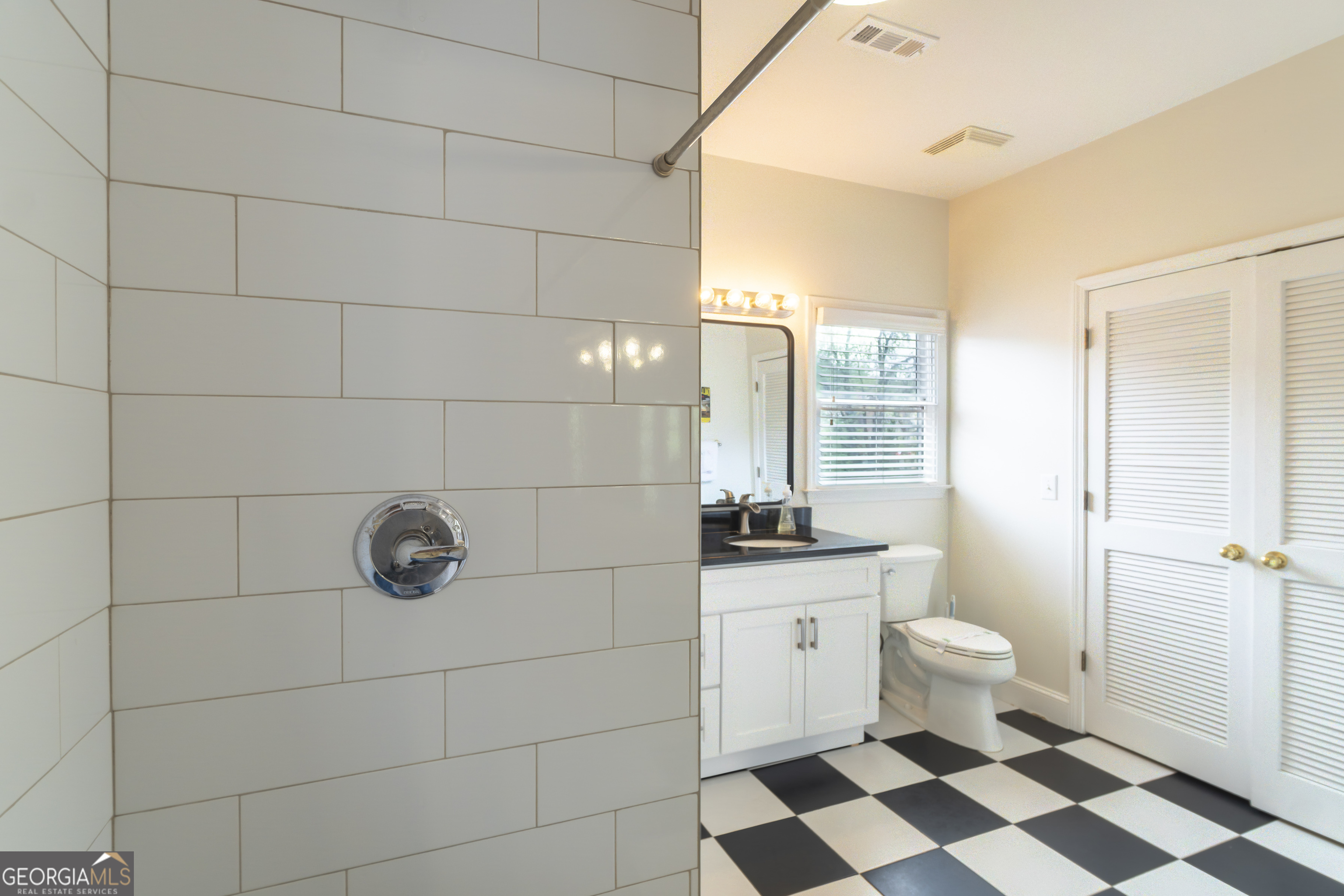 892 Edelweiss Strasse Helen, GA 30545 - Photo 25 of 36 a bathroom with a toilet a sink and a shower
