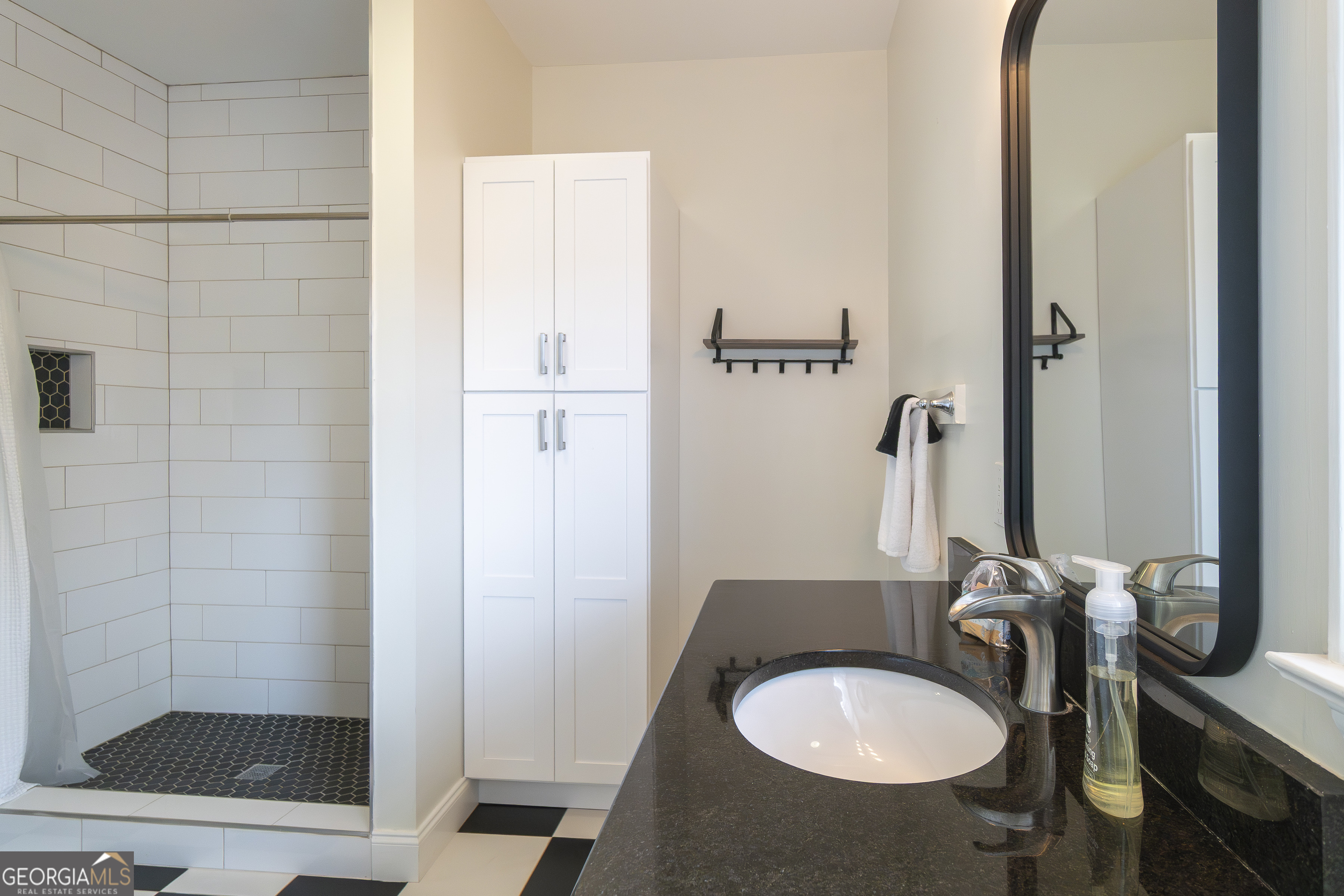 892 Edelweiss Strasse Helen, GA 30545 - Photo 28 of 36 a bathroom with a sink a toilet and shower
