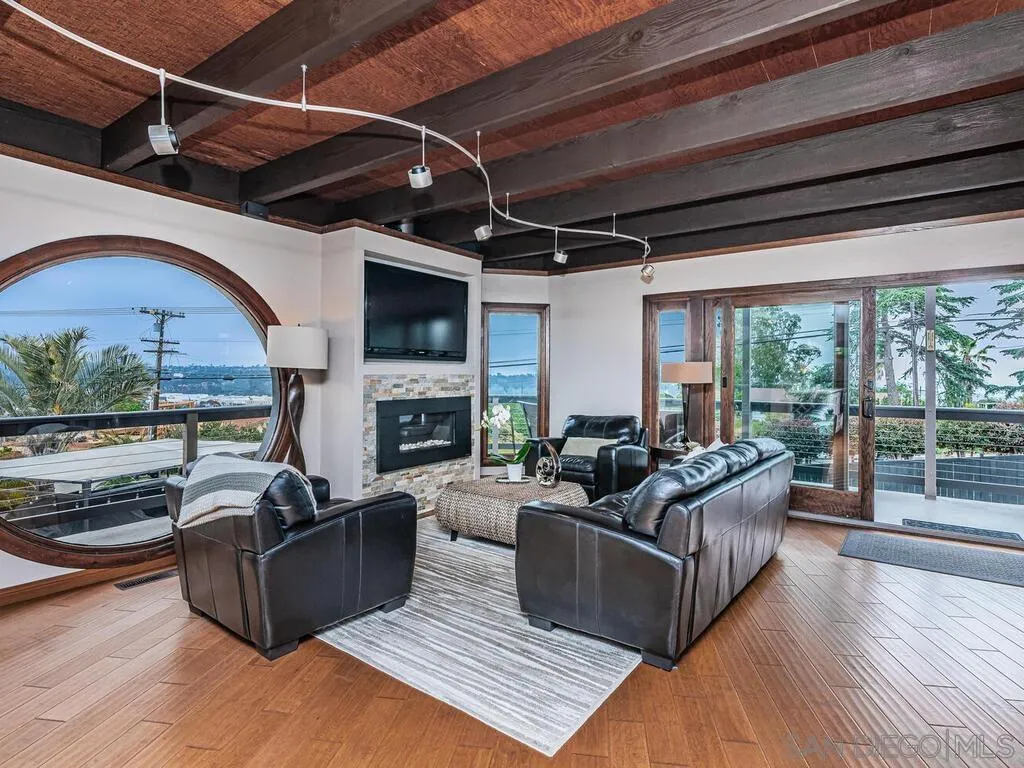 1838 Laurel Road Oceanside, CA 92054 - Photo 14 of 71 a living room with furniture fireplace and a flat screen tv