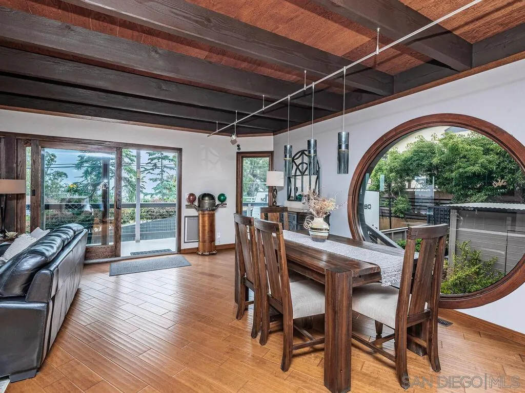 1838 Laurel Road Oceanside, CA 92054 - Photo 17 of 71 a dining room with furniture window wooden floor and garden view