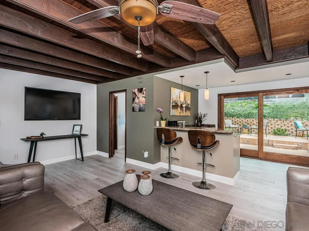 1838 Laurel Road Oceanside, CA 92054 - Photo 36 of 71 a living room with furniture and a flat screen tv