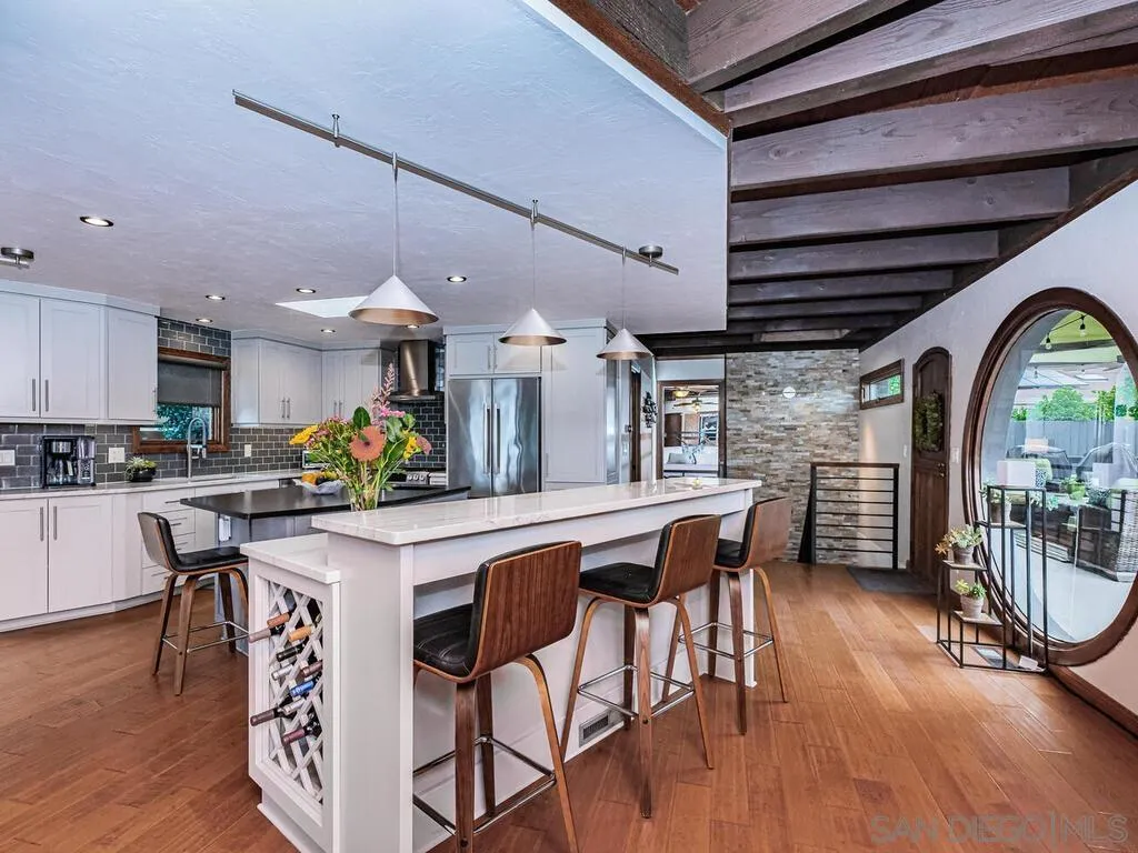 1838 Laurel Road Oceanside, CA 92054 - Photo 4 of 71 a view of a dining room with furniture and wooden floor