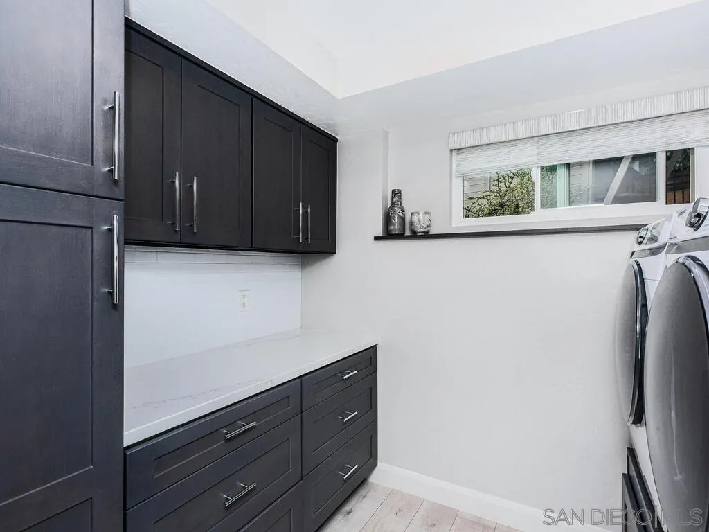 1838 Laurel Road Oceanside, CA 92054 - Photo 43 of 71 a view of cabinets with wooden floor and cabinet