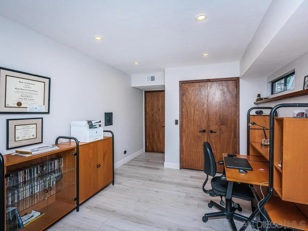 1838 Laurel Road Oceanside, CA 92054 - Photo 46 of 71 a view of a workspace with furniture and a bedroom
