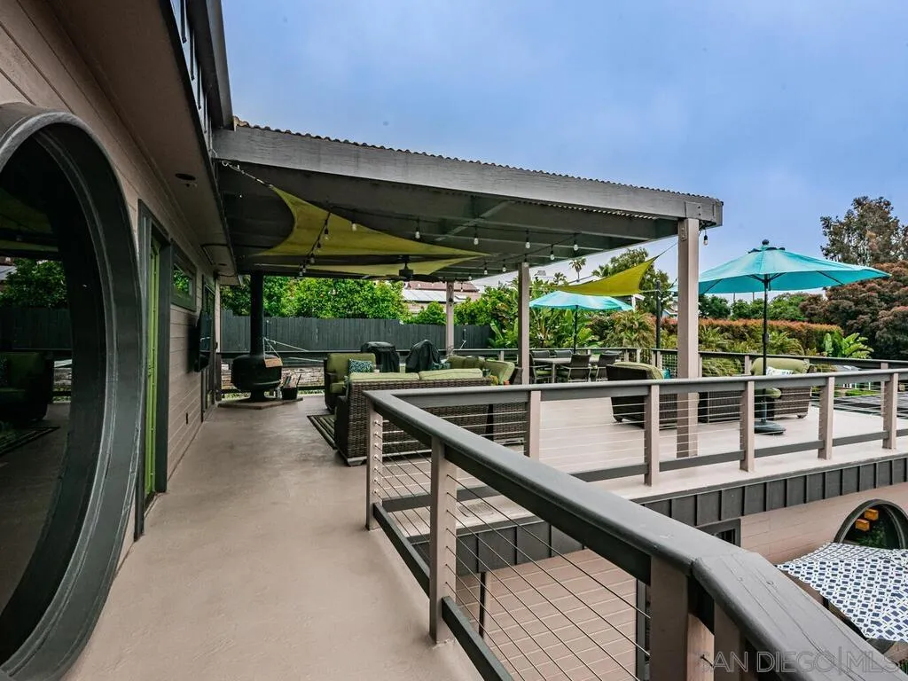 1838 Laurel Road Oceanside, CA 92054 - Photo 49 of 71 a view of a balcony with chairs and wooden fence