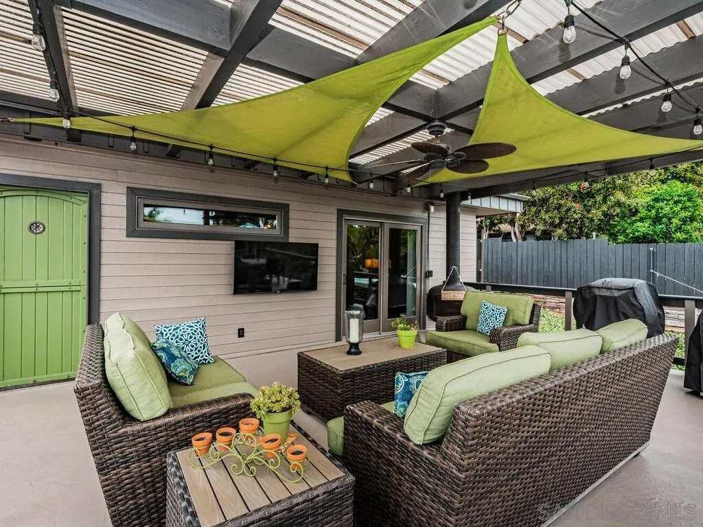 1838 Laurel Road Oceanside, CA 92054 - Photo 51 of 71 a outdoor living space with furniture and a black umbrella