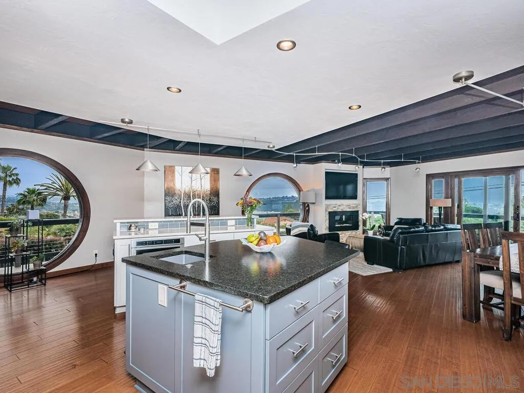 1838 Laurel Road Oceanside, CA 92054 - Photo 6 of 71 a kitchen with stainless steel appliances granite countertop a stove and a wooden floors