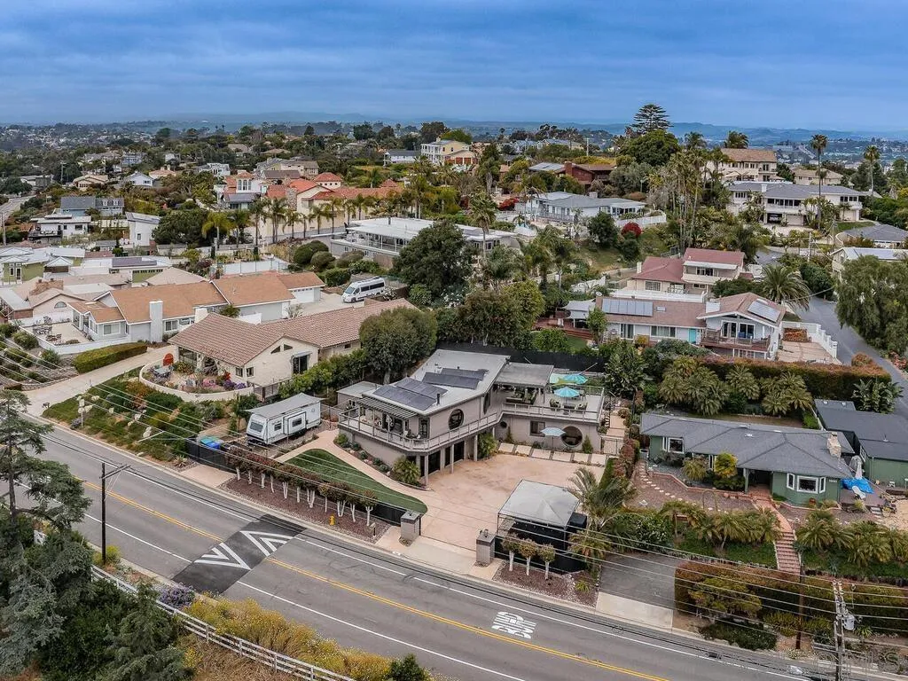 1838 Laurel Road Oceanside, CA 92054 - Photo 68 of 71 an aerial view of a city with lots of residential buildings and ocean view in back