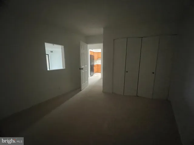 a view of an empty room and window