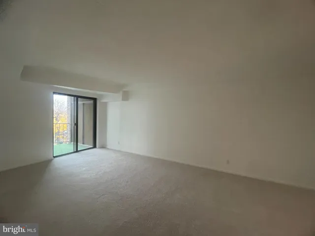 a view of a big room with windows and cabinet