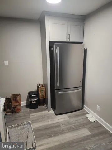 a refrigerator freezer sitting in a kitchen