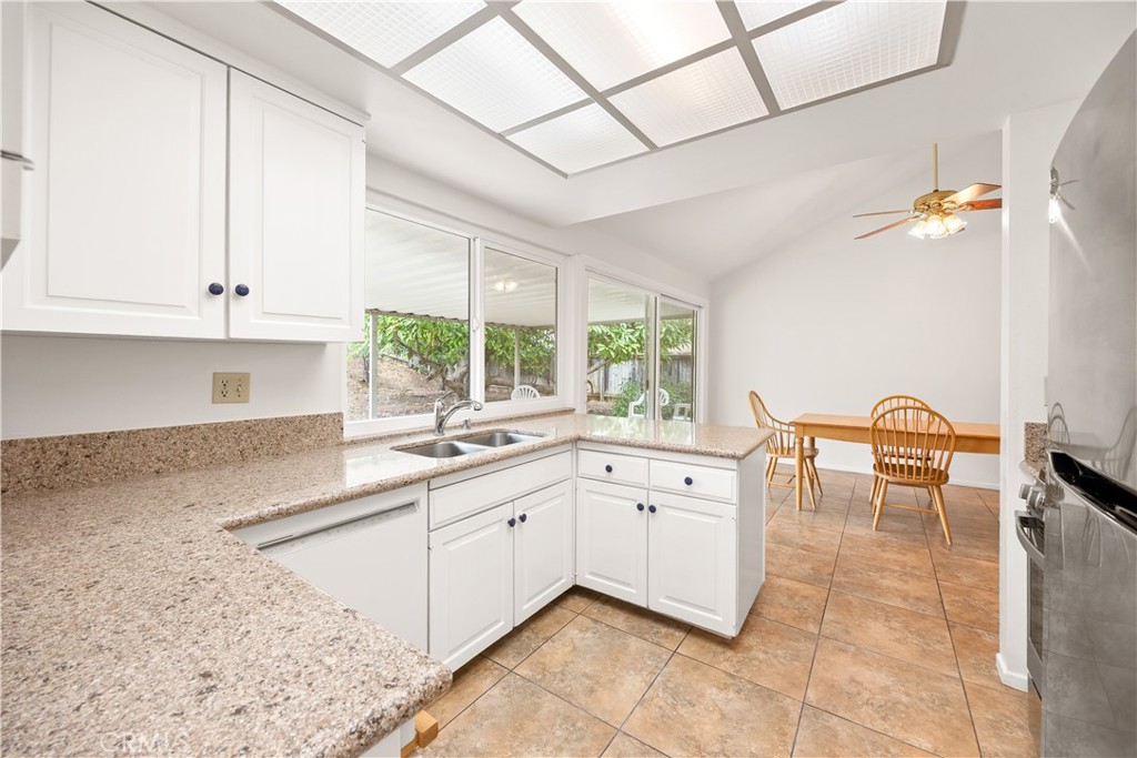 3430 Bahia Place Riverside, CA 92507 - Photo 19 of 34 a kitchen with a sink and cabinets