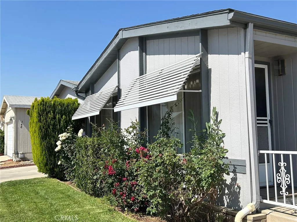 27250 Murrieta Road, Unit 347 Menifee, CA 92586 - Photo 35 of 38 a front view of a house with garden