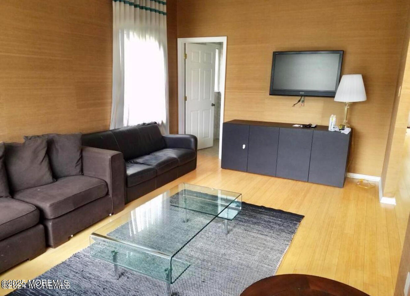 95 Poplar Avenue Deal, NJ 07723 - Photo 3 of 9 a living room with couches and a flat screen tv