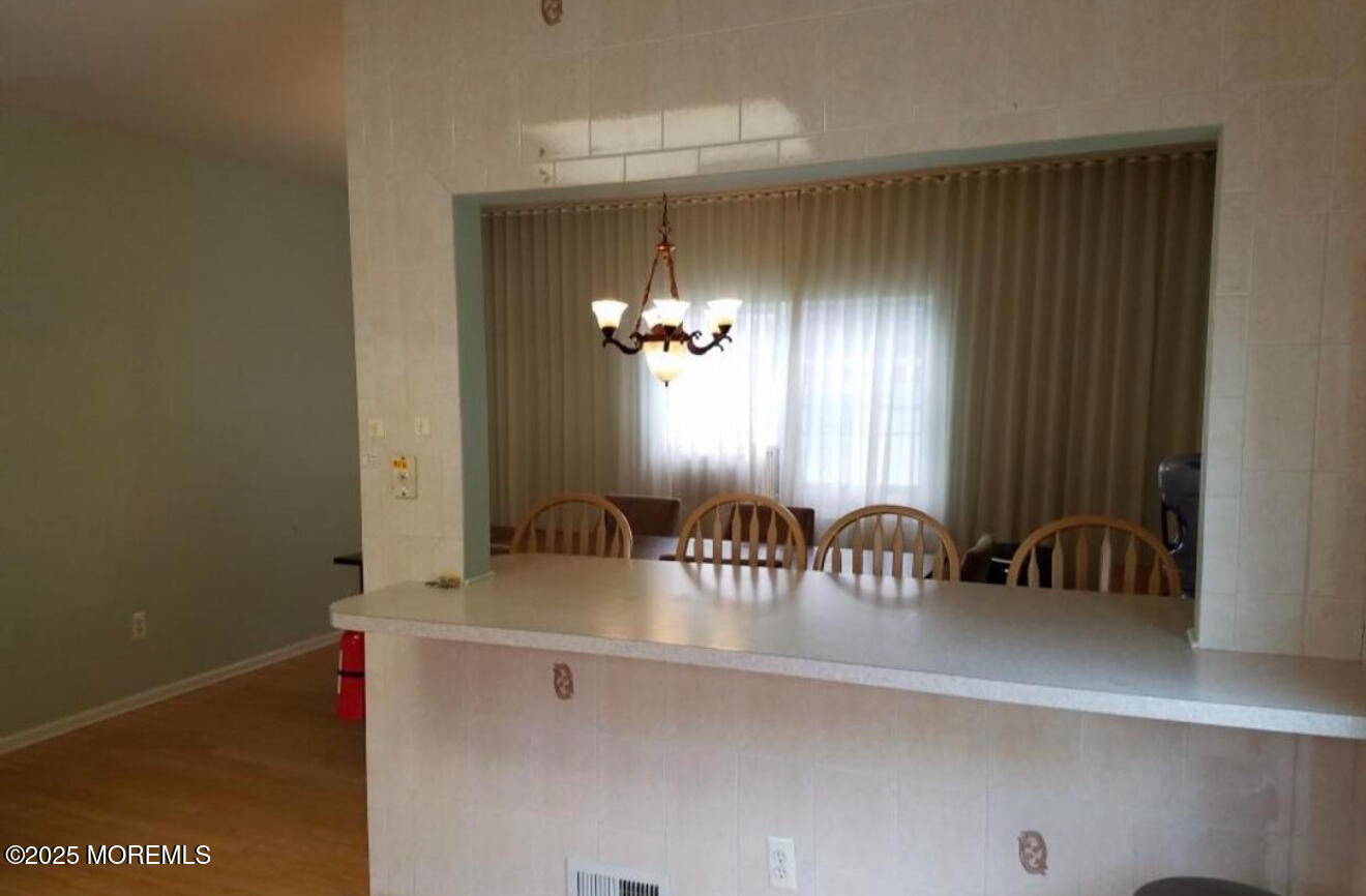 95 Poplar Avenue Deal, NJ 07723 - Photo 7 of 9 a bathroom with a sink and a mirror