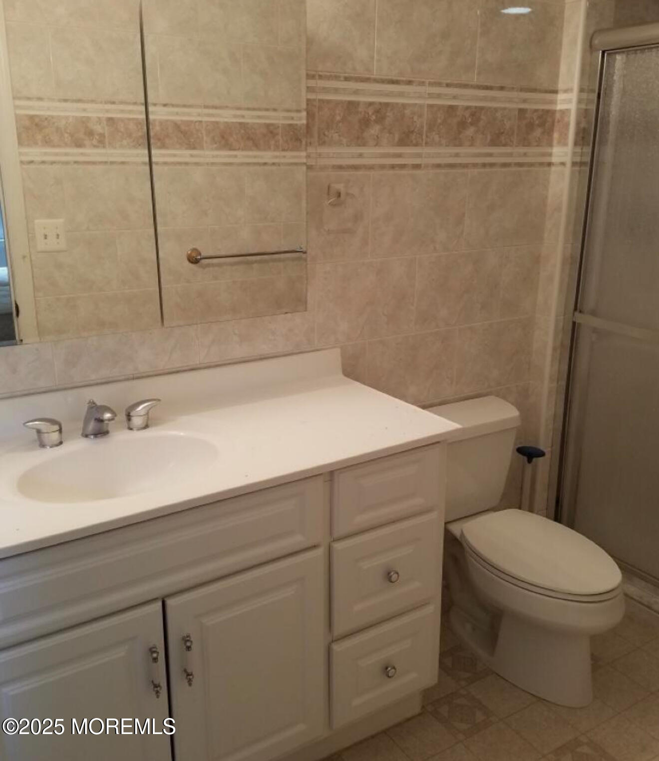 95 Poplar Avenue Deal, NJ 07723 - Photo 9 of 9 a bathroom with a sink a toilet and a shower