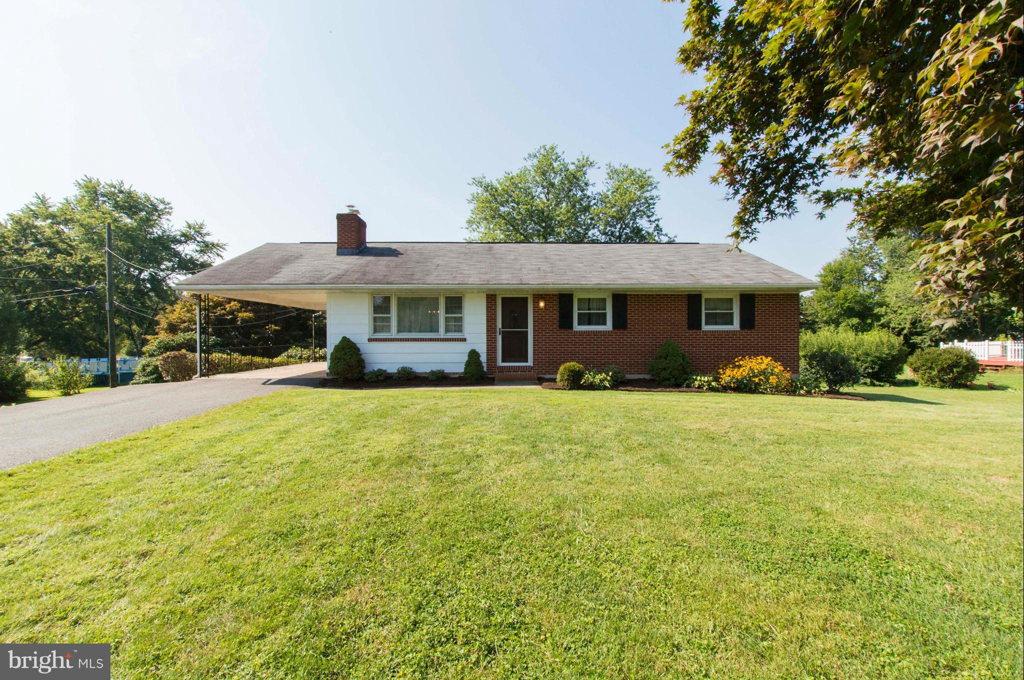 2903 Ashwood Road Fallston, MD 21047 - Photo 1 of 30 a front view of a house with a garden
