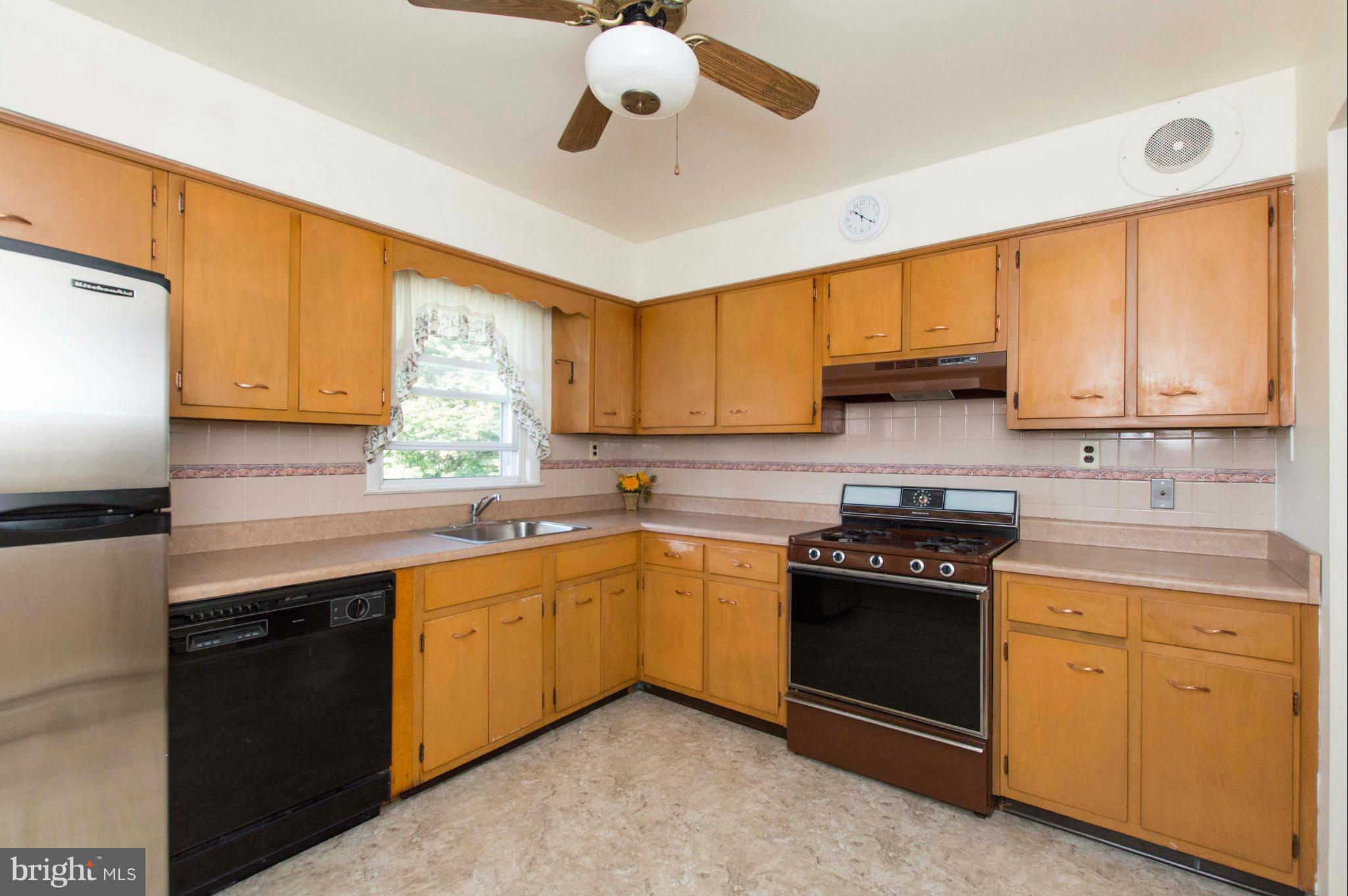 2903 Ashwood Road Fallston, MD 21047 - Photo 11 of 30 a kitchen with stainless steel appliances granite countertop a sink stove and refrigerator