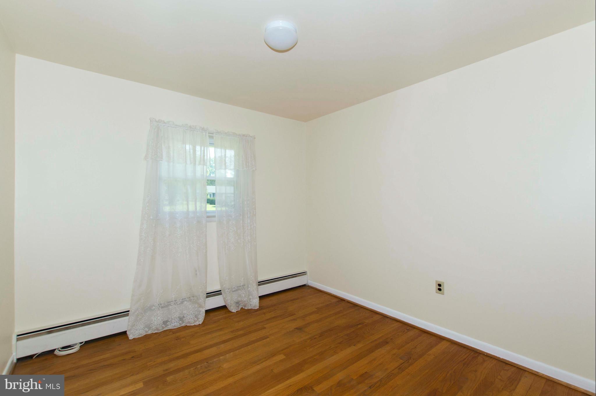 2903 Ashwood Road Fallston, MD 21047 - Photo 14 of 30 a view of an empty room with wooden floor