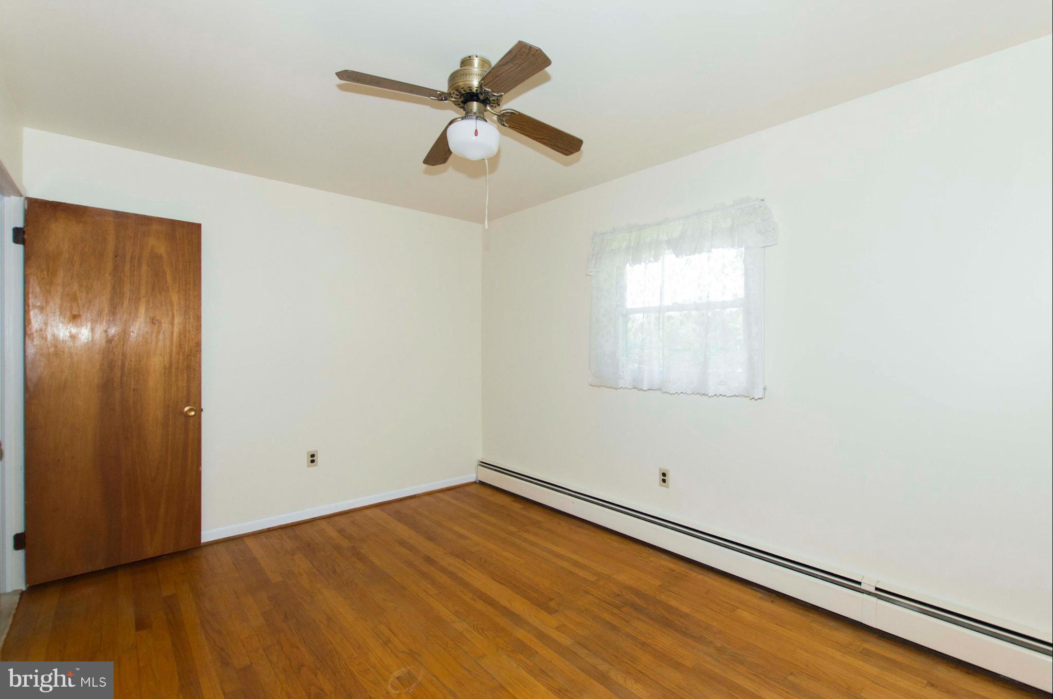 2903 Ashwood Road Fallston, MD 21047 - Photo 20 of 30 an empty room with a window and ceiling fan