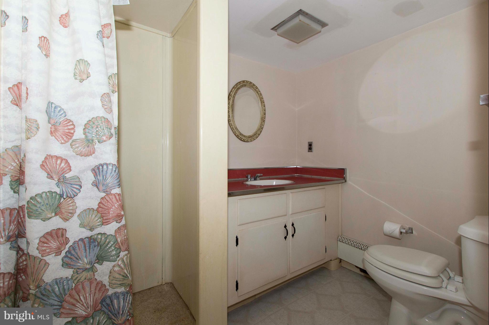 2903 Ashwood Road Fallston, MD 21047 - Photo 27 of 30 a bathroom with a toilet sink vanity and mirror